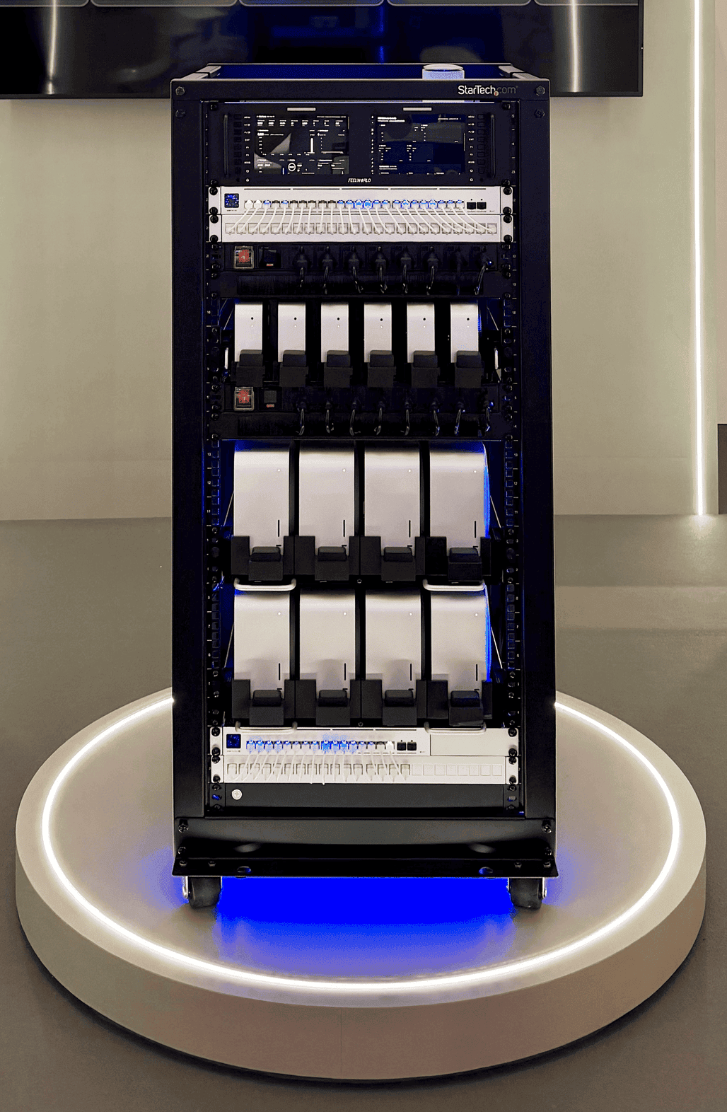 Front view of the Mac Hive containing six Mac mini and eight Mac Studio systems at Tech Week Singapore 2026