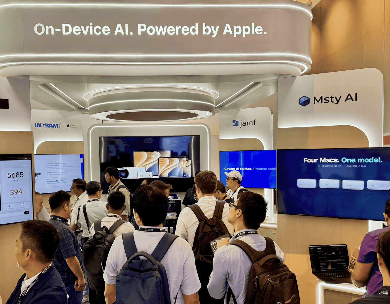 Visitors exploring the On-Device AI Powered by Apple booth at Tech Week Singapore 2026